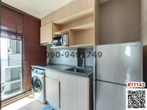 Compact and modern kitchen with appliances and ample storage space