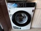 Modern Toshiba washing machine in a property's laundry space