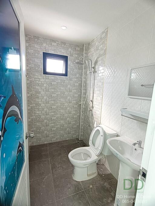 Modern bathroom with shower and aquatic themed decoration