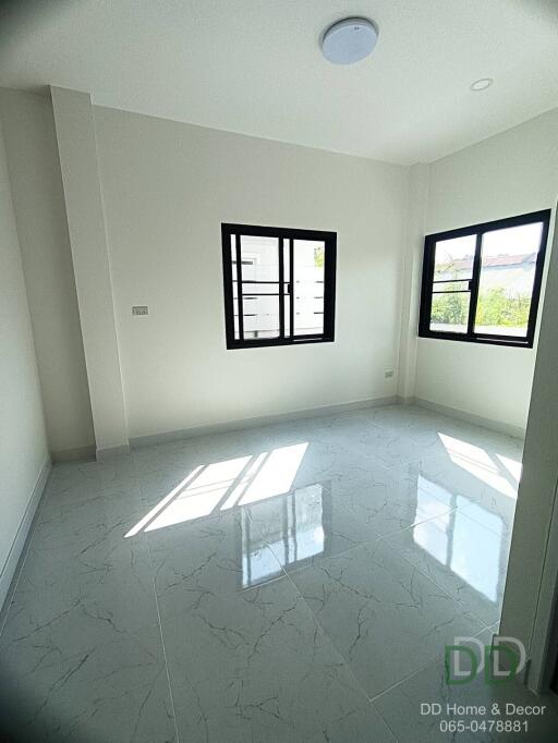 Bright and clean bedroom with large window and glossy tiled floor