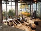 Modern gym facility with expansive windows in an urban apartment complex