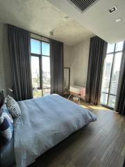 Modern bedroom with natural light and city view