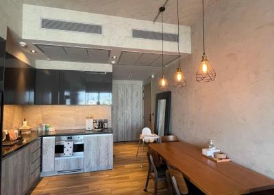 Modern kitchen with wooden details and pendant lighting