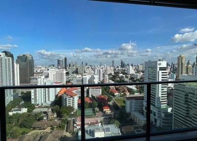 Panoramic cityscape view from high-rise apartment balcony