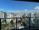 Panoramic cityscape view from high-rise apartment balcony