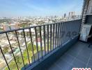 Spacious balcony with city skyline view