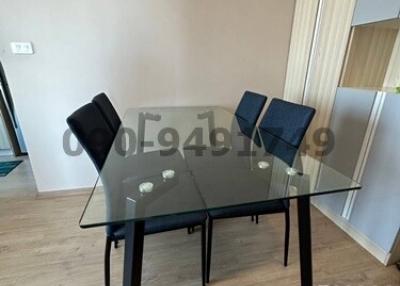 Modern dining area with glass table and chairs