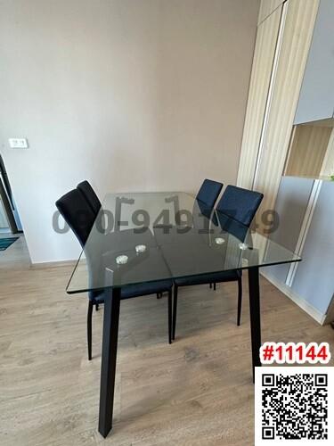 Modern dining area with glass table and chairs