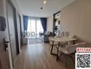 Spacious and modern living room with dining area and adjoining balcony