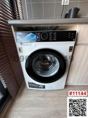 Modern Toshiba washing machine in a kitchen setting