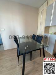 Modern dining area with glass table and chairs