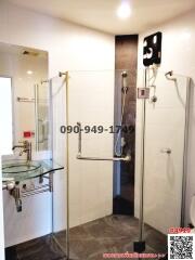 Modern bathroom with glass shower and vessel sink