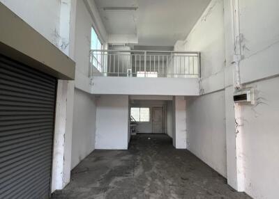 Spacious unfinished interior of a commercial building with mezzanine floor