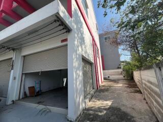 Exterior view of a modern building with garage and a clear driveway