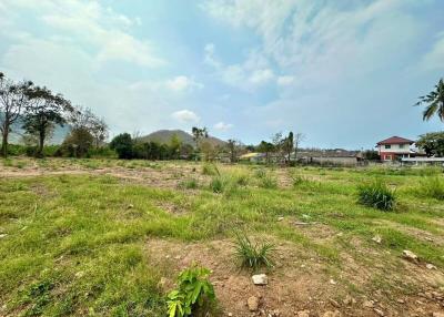 Spacious outdoor area with potential for development under a clear sky