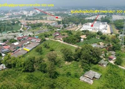 Aerial view of an expansive property lot adjacent to residential area