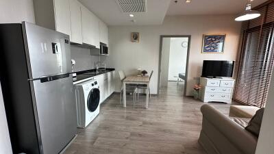 Open concept living area with kitchen and modern appliances