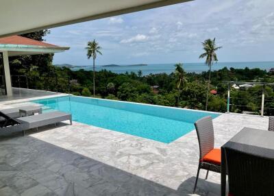 Luxurious outdoor terrace with a beautiful sea view and private swimming pool