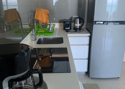 Modern kitchen with stainless steel appliances and white cabinets