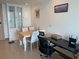 Modern living room with dining area and clean white interiors