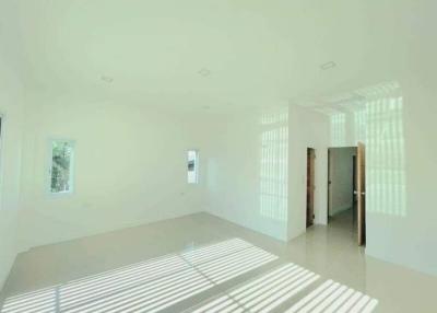 Bright and spacious empty living room with large windows