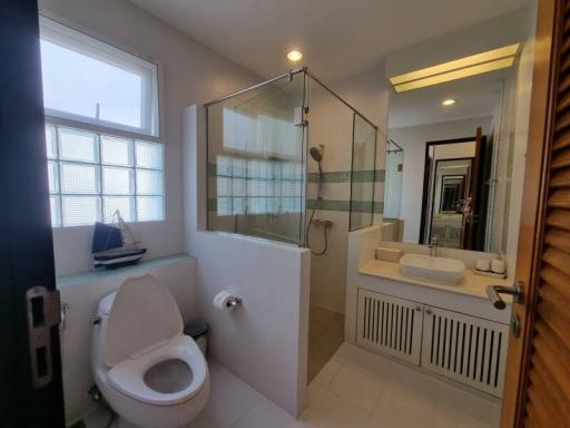 Modern bathroom with glass shower and window