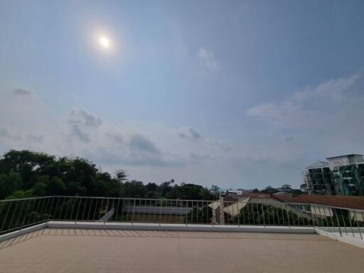 Spacious balcony with a scenic view and clear skies
