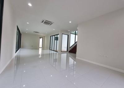 Spacious and well-lit empty interior space with reflective flooring
