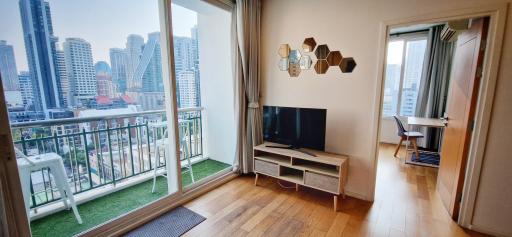 Modern living room with city view and balcony access