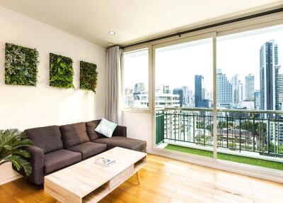 Modern living room with city view and balcony access