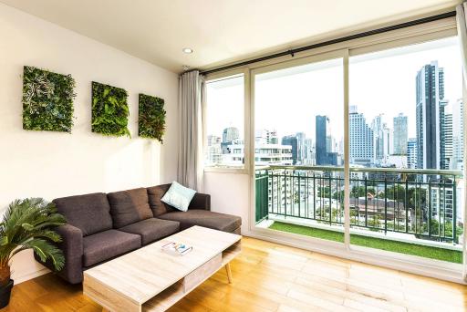 Modern living room with city view and balcony access