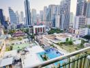 Panoramic city view from a high-rise balcony