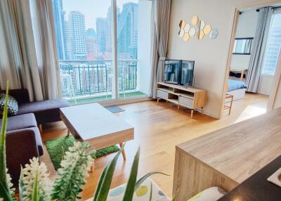 Spacious living room with modern furnishings and city view