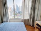 Cozy bedroom with city view and natural light