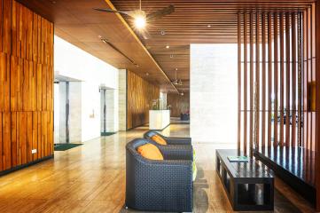 Modern lobby interior with wooden elements and contemporary furniture