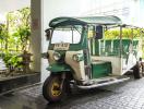 Thailand traditional tuk tuk parked in building entrance