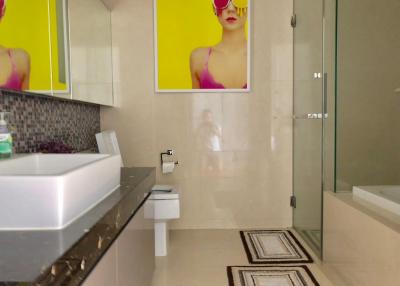 Modern bathroom interior with vibrant art decor