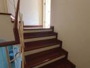 Wooden staircase leading to an upper level of a house