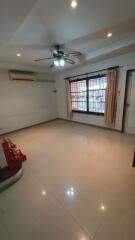 Spacious and well-lit living room with modern amenities