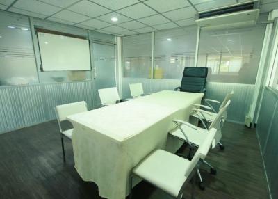 Spacious modern office interior with conference table and chairs