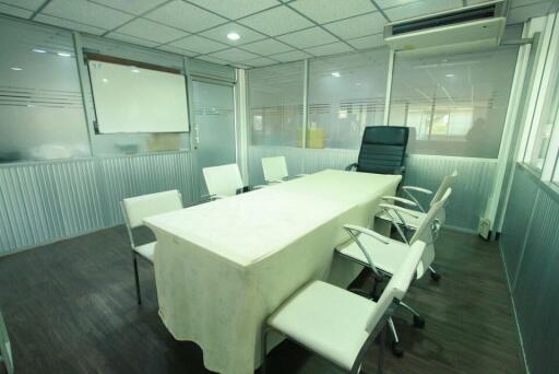 Spacious modern office interior with conference table and chairs