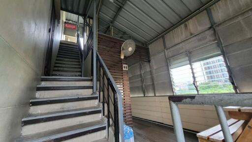 Interior staircase with metal and wood finishes in a modern building