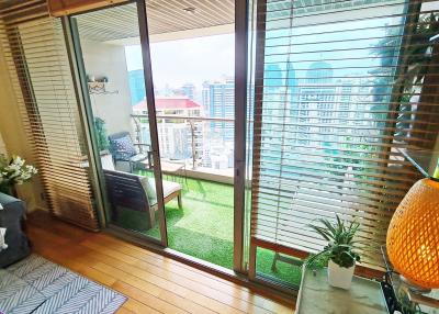 Modern balcony with seating area and city view