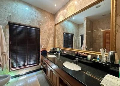 Spacious bathroom with modern fixtures and ample lighting
