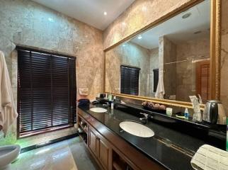 Spacious bathroom with modern fixtures and ample lighting