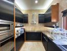 Modern kitchen with black cabinets and built-in appliances