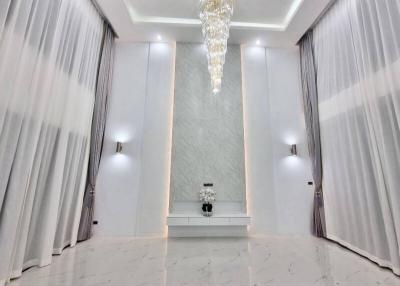 Elegant interior design of a modern building foyer with chandelier and marble flooring