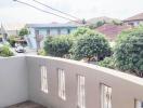 Spacious balcony with a view of a residential neighborhood