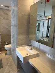 Modern bathroom interior with marble tiling