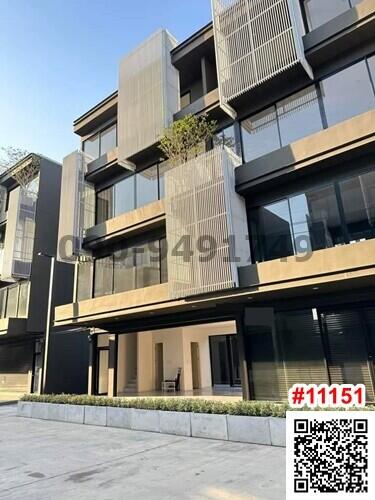 Contemporary multi-story residential building facade with balconies and modern design